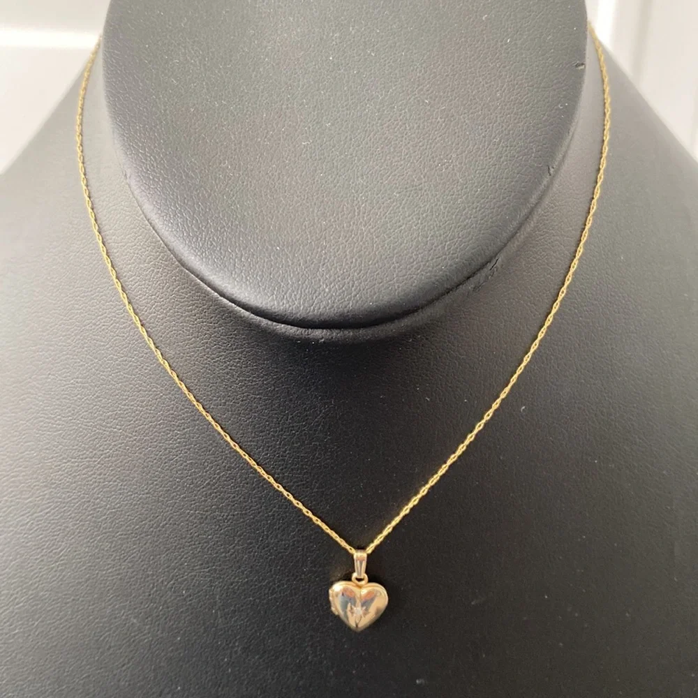 Mignonette NWOT gold, and diamond heart locket necklace